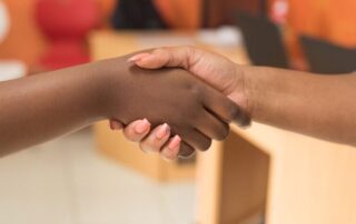 two people shaking hands