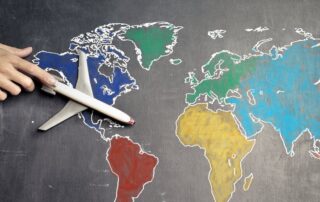 airplane traveling across a map of the world